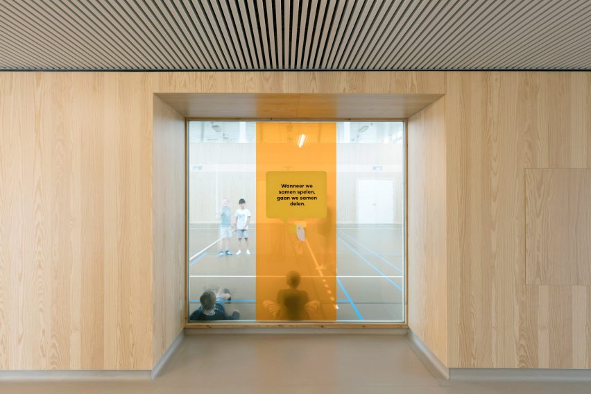 NL Architects completes Belgian school featuring low-lying rooms surrounded by a colonnade