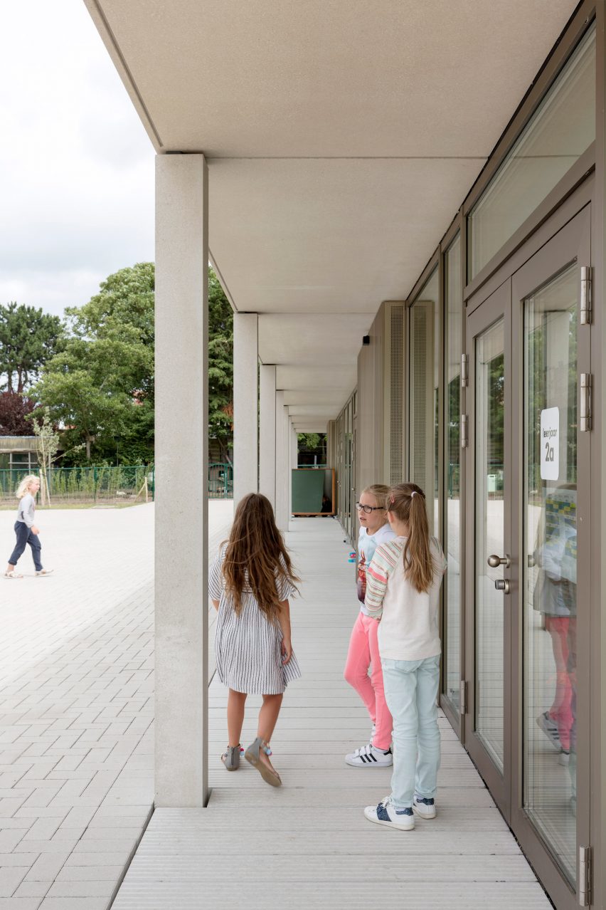 NL Architects completes Belgian school featuring low-lying rooms surrounded by a colonnade
