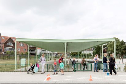 NL Architects completes Belgian school featuring low-lying rooms surrounded by a colonnade