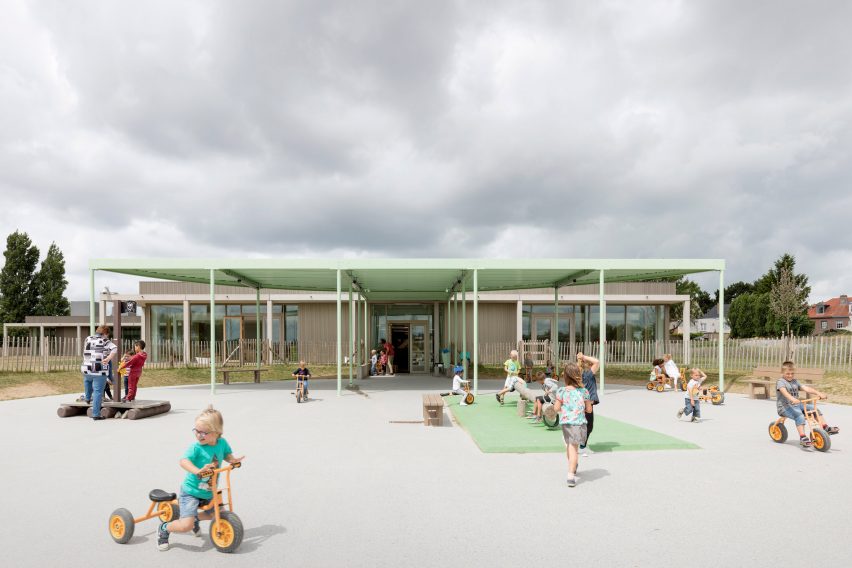 NL Architects completes Belgian school featuring low-lying rooms surrounded by a colonnade