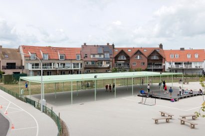 NL Architects completes Belgian school featuring low-lying rooms surrounded by a colonnade