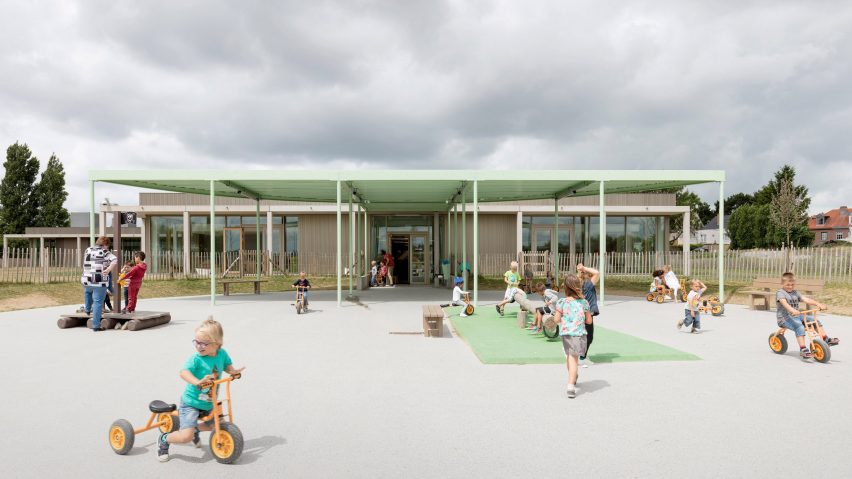 NL Architects completes Belgian school featuring low-lying rooms surrounded by a colonnade