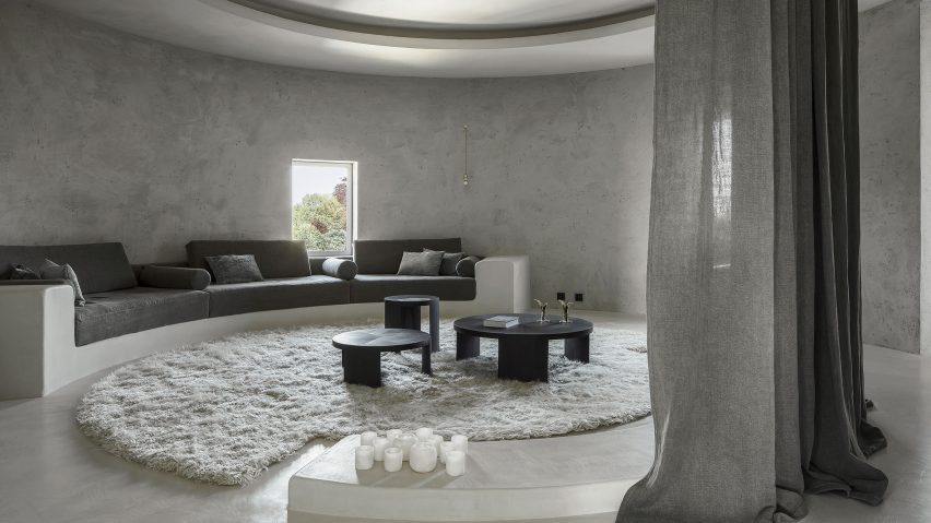 Arjaan De Feyter creates round monochrome living spaces in former silo building near Antwerp