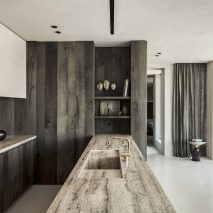 Arjaan De Feyter creates round monochrome living spaces in former silo building near Antwerp
