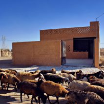 Sprayed render covers walls of rural Iranian house by BAM Architects Office