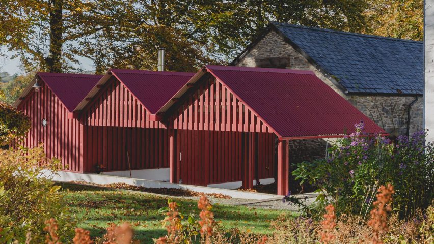 Rural Office for Architecture adds row of red gabled sheds to rural Welsh property