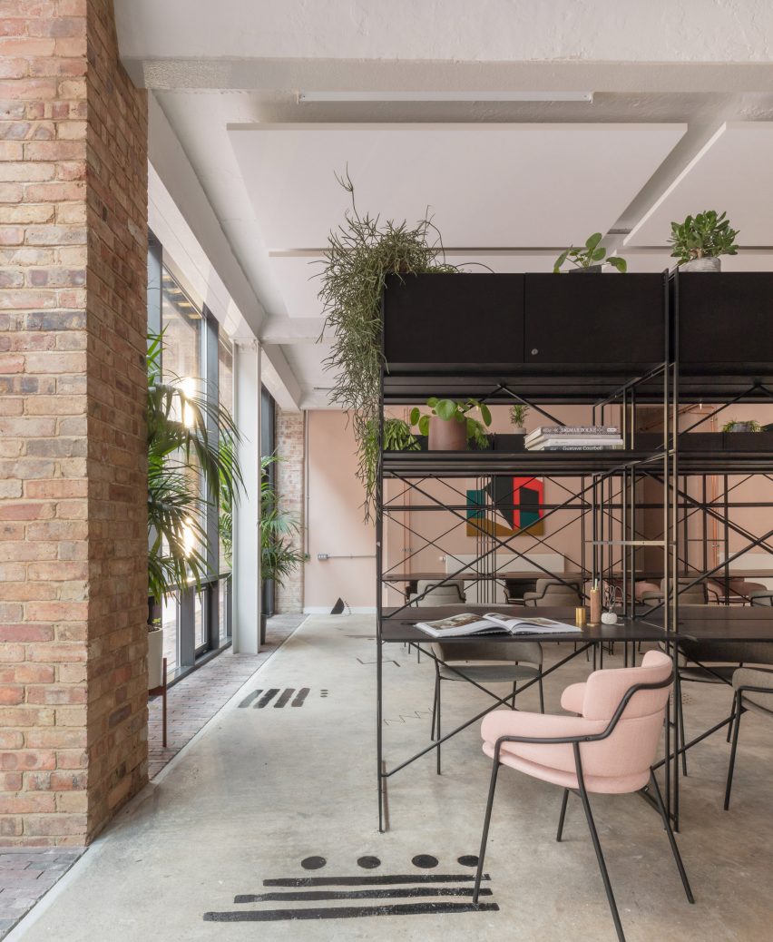 The smooth surface and soft-pink hue of a newly plastered wall provided the starting point for the design of communal spaces at this new creative hub in east London by local studio Sella Concept.