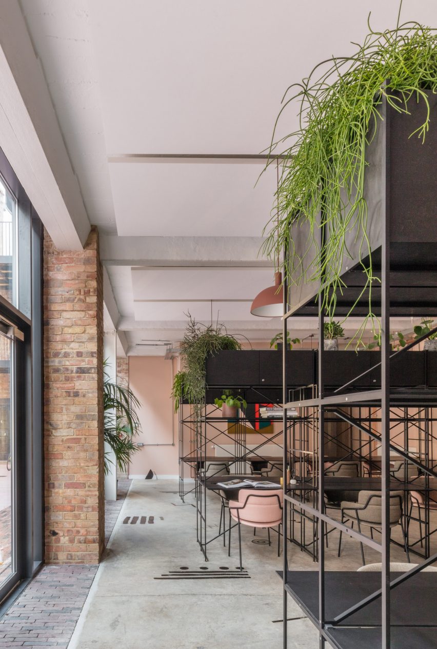 The smooth surface and soft-pink hue of a newly plastered wall provided the starting point for the design of communal spaces at this new creative hub in east London by local studio Sella Concept.