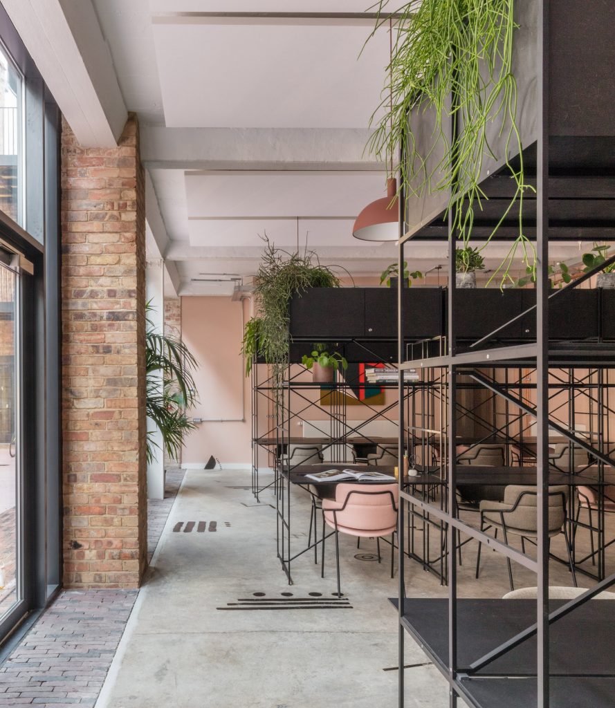 The smooth surface and soft-pink hue of a newly plastered wall provided the starting point for the design of communal spaces at this new creative hub in east London by local studio Sella Concept.