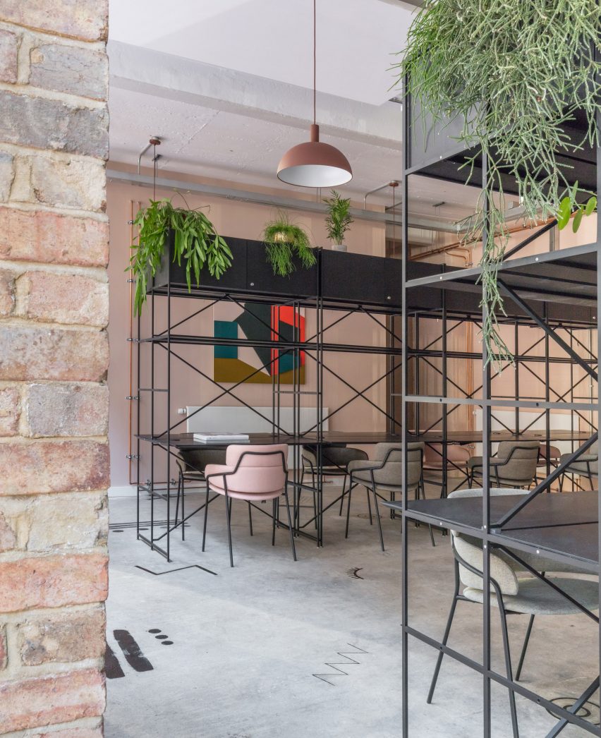 The smooth surface and soft-pink hue of a newly plastered wall provided the starting point for the design of communal spaces at this new creative hub in east London by local studio Sella Concept.