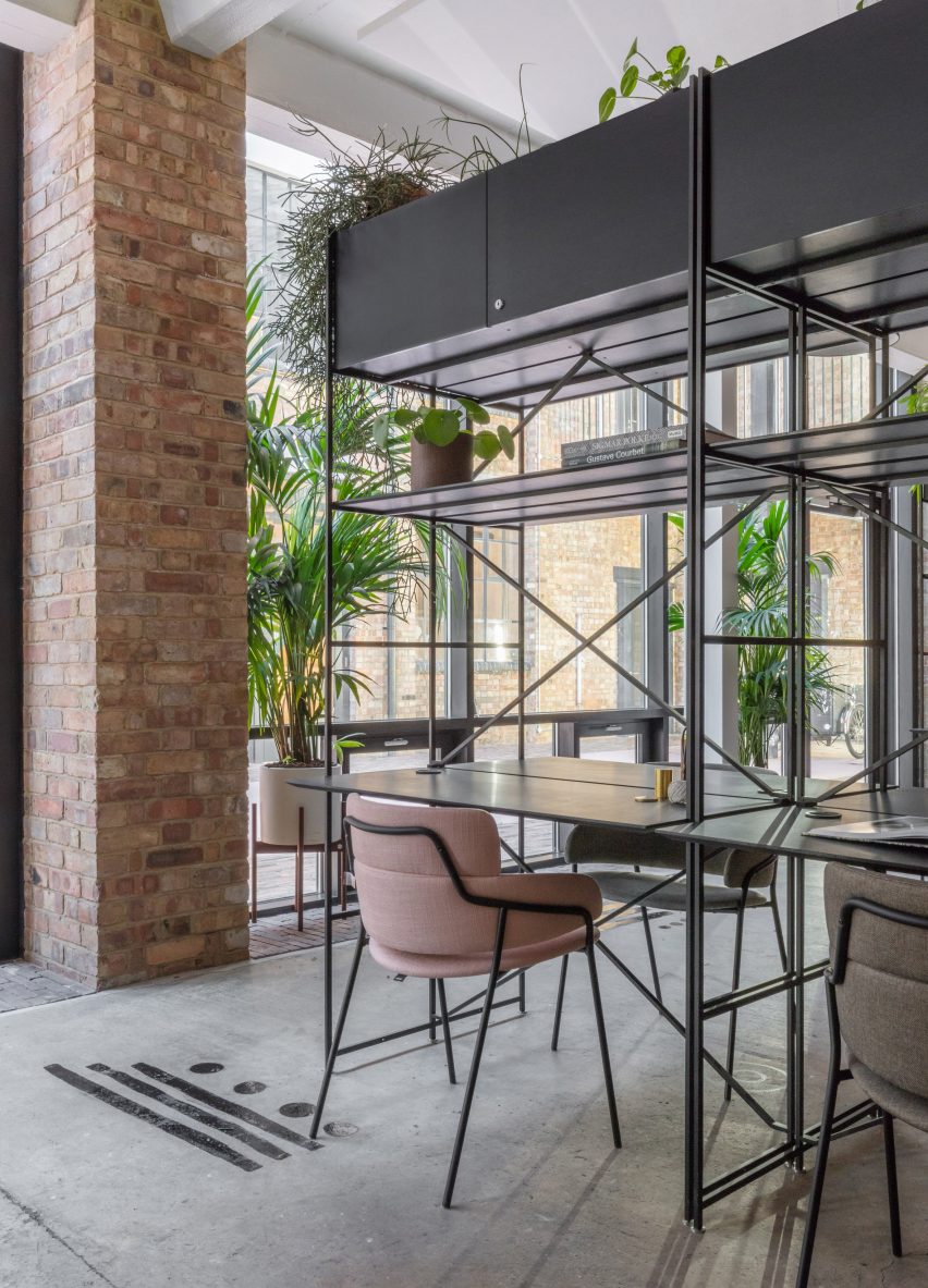 The smooth surface and soft-pink hue of a newly plastered wall provided the starting point for the design of communal spaces at this new creative hub in east London by local studio Sella Concept.