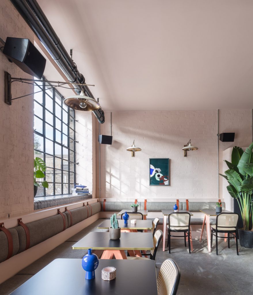 The smooth surface and soft-pink hue of a newly plastered wall provided the starting point for the design of communal spaces at this new creative hub in east London by local studio Sella Concept.