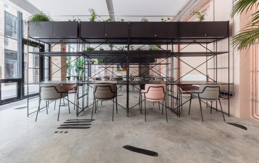 The smooth surface and soft-pink hue of a newly plastered wall provided the starting point for the design of communal spaces at this new creative hub in east London by local studio Sella Concept.