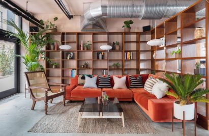 The smooth surface and soft-pink hue of a newly plastered wall provided the starting point for the design of communal spaces at this new creative hub in east London by local studio Sella Concept.