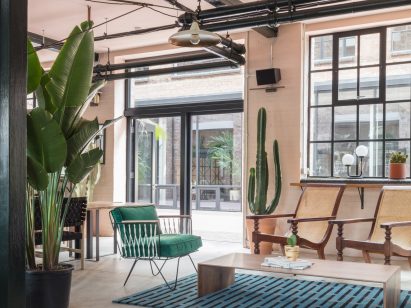 The smooth surface and soft-pink hue of a newly plastered wall provided the starting point for the design of communal spaces at this new creative hub in east London by local studio Sella Concept.