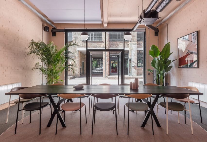 The smooth surface and soft-pink hue of a newly plastered wall provided the starting point for the design of communal spaces at this new creative hub in east London by local studio Sella Concept.