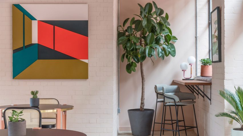 The smooth surface and soft-pink hue of a newly plastered wall provided the starting point for the design of communal spaces at this new creative hub in east London by local studio Sella Concept.