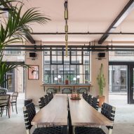 The smooth surface and soft-pink hue of a newly plastered wall provided the starting point for the design of communal spaces at this new creative hub in east London by local studio Sella Concept.