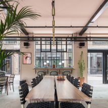 The smooth surface and soft-pink hue of a newly plastered wall provided the starting point for the design of communal spaces at this new creative hub in east London by local studio Sella Concept.