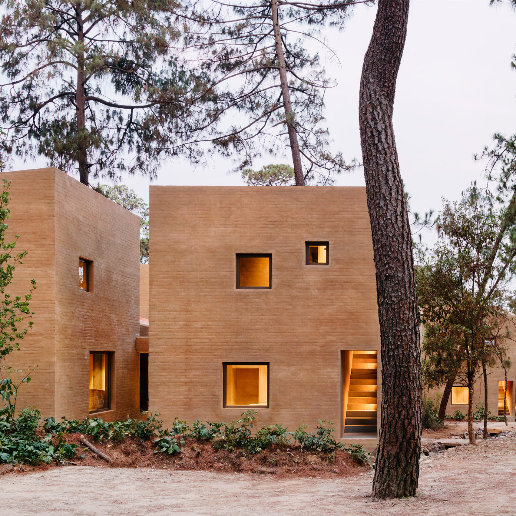 Soil-based render creates terracotta-coloured walls for houses in