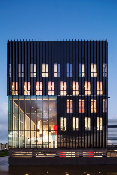 Benthem Crouwel adds stripy tower surrounded by a moat to Amsterdam data centre