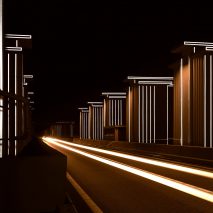 Restored floodgates by Studio Roosegaarde reflect the headlights of passing cars