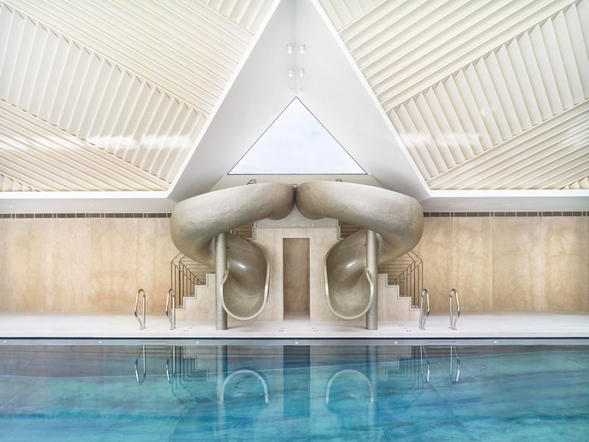 Rafael de Cárdenas adds pool house with stripy patterned ceiling and symmetrical slides to English country manor