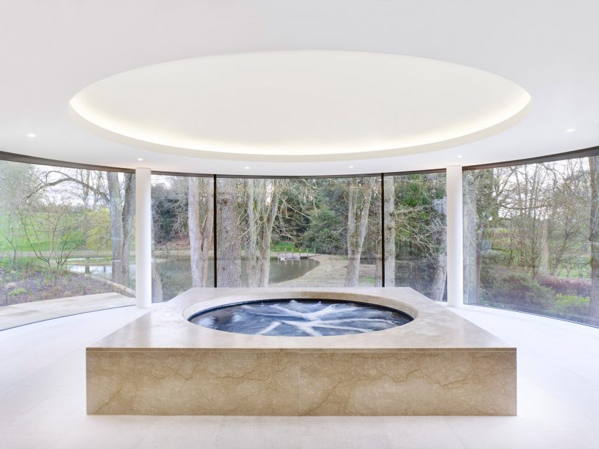 Rafael de Cárdenas adds pool house with stripy patterned ceiling and symmetrical slides to English country manor