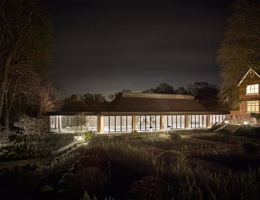 Rafael de Cárdenas adds pool house with stripy patterned ceiling and symmetrical slides to English country manor