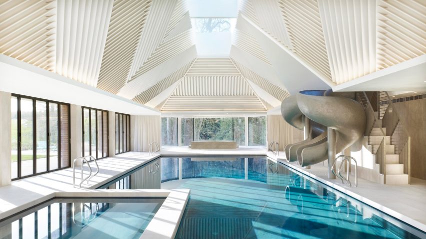 Rafael de Cárdenas adds pool house with stripy patterned ceiling and symmetrical slides to English country manor