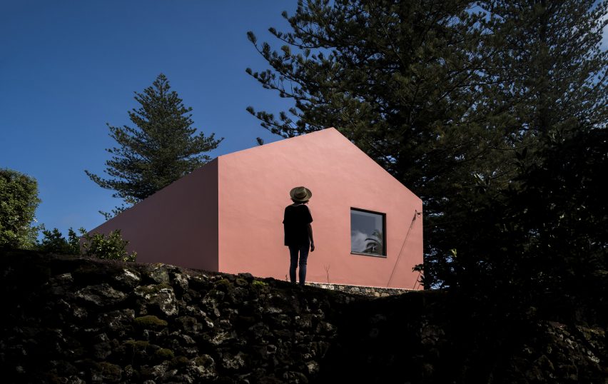 Mezzo Atelier transforms century-old barn into pair of bright pink guesthouses