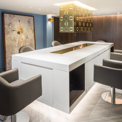 Soho salon by Jak Studio gathers patrons around a fire pit