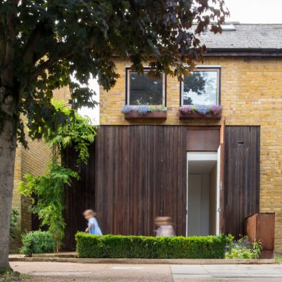 Checa Romero Architects “makes the most” of small brick house by extending in every direction