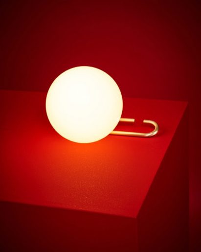 Neri&Hu's lantern-inspired lights sit on or hang from adjustable brass rings