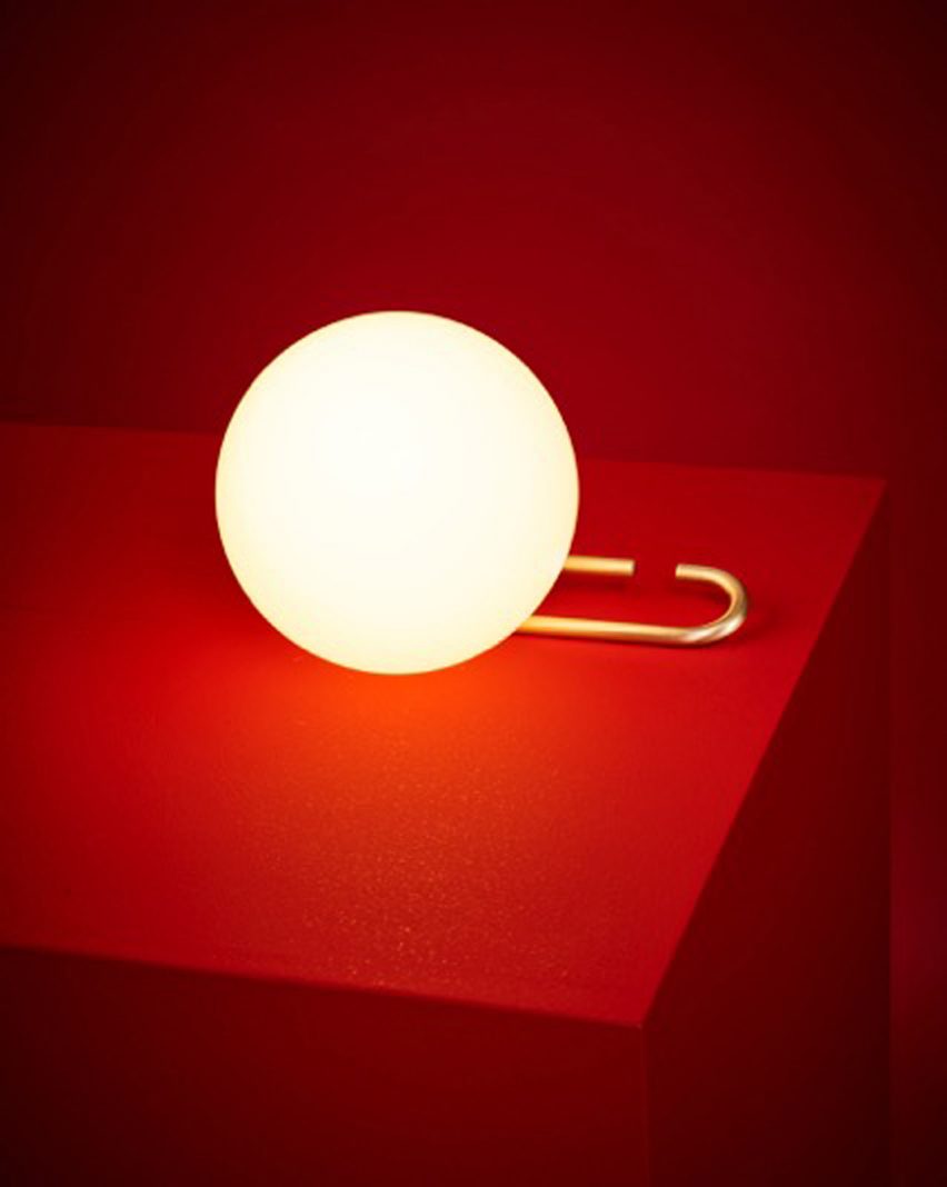 Neri&Hu's lantern-inspired lights sit on or hang from adjustable brass rings