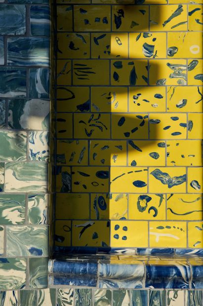Assemble give Seven Sisters station tiled facade in tiles