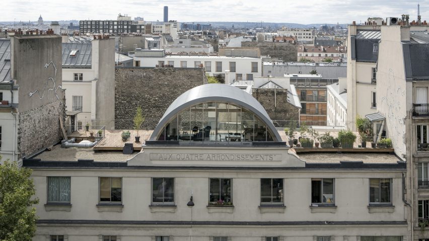 Post Office Architectes adds vaulted roof extension to Paris apartment for a photographer