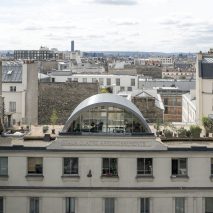 Post Office Architectes adds vaulted roof extension to Paris apartment for a photographer