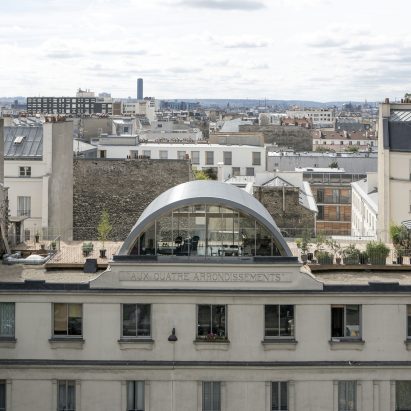 Post Office Architectes adds vaulted roof extension to Paris apartment for a photographer