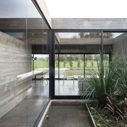 10 home interiors that make use of board-marked concrete