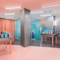 Masquespacio creates colour-clashing interior for phone-repair shop in Valencia