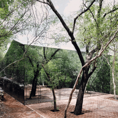 Reflective holiday home by Tatiana Bilbao hides among trees in Mexico