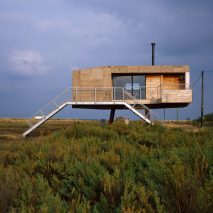 Redshank artist’s studio is a cork-clad cabin raised above a tidal salt marsh