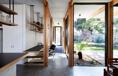 This single-storey house in Melbourne has been renovated by local studio Foomann to include exposed wooden beams that span the entirety of the property.