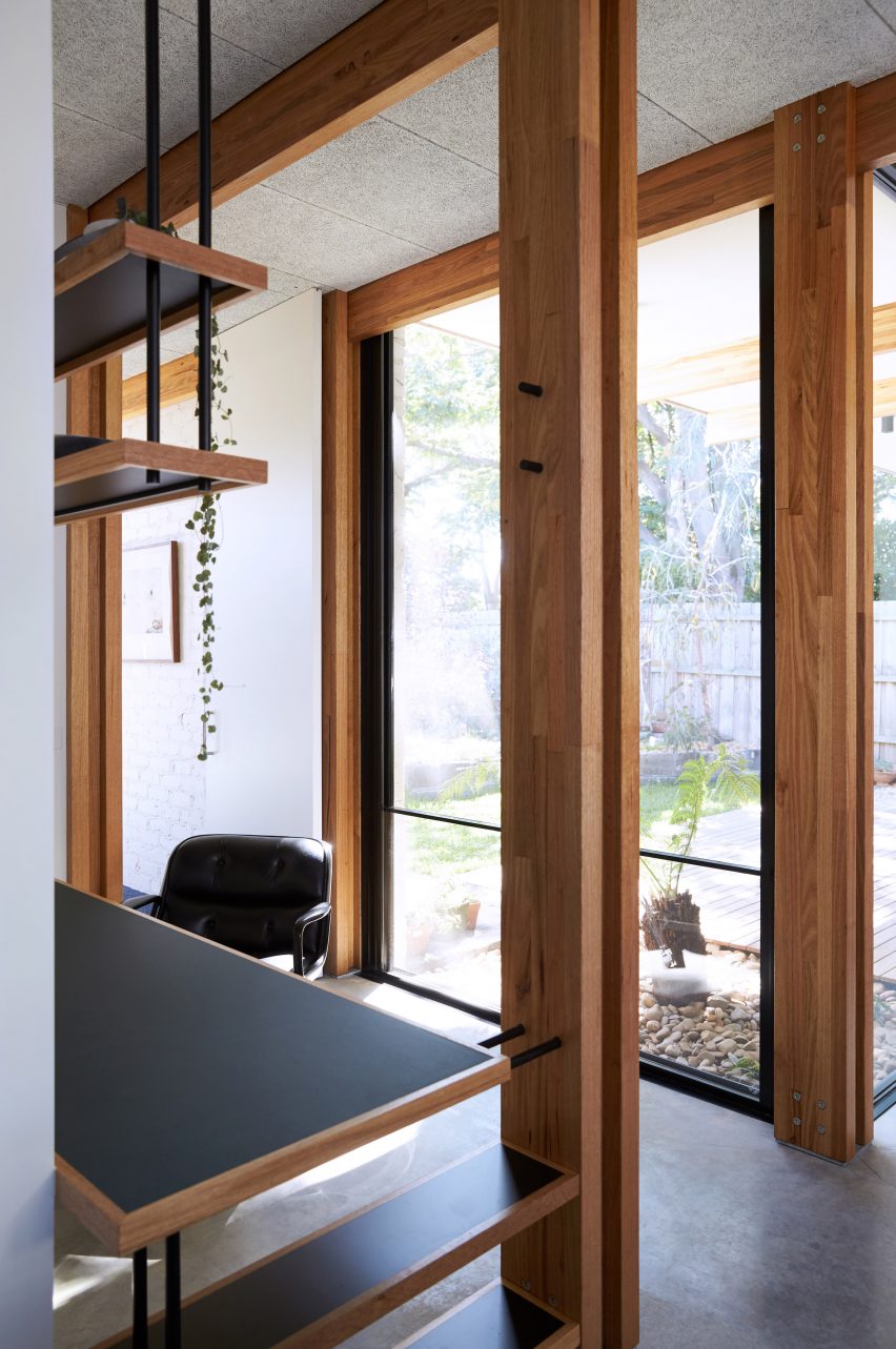 This single-storey house in Melbourne has been renovated by local studio Foomann to include exposed wooden beams that span the entirety of the property.