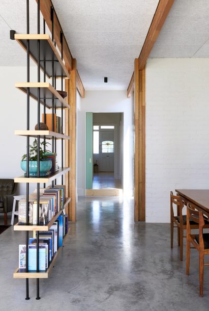 This single-storey house in Melbourne has been renovated by local studio Foomann to include exposed wooden beams that span the entirety of the property.