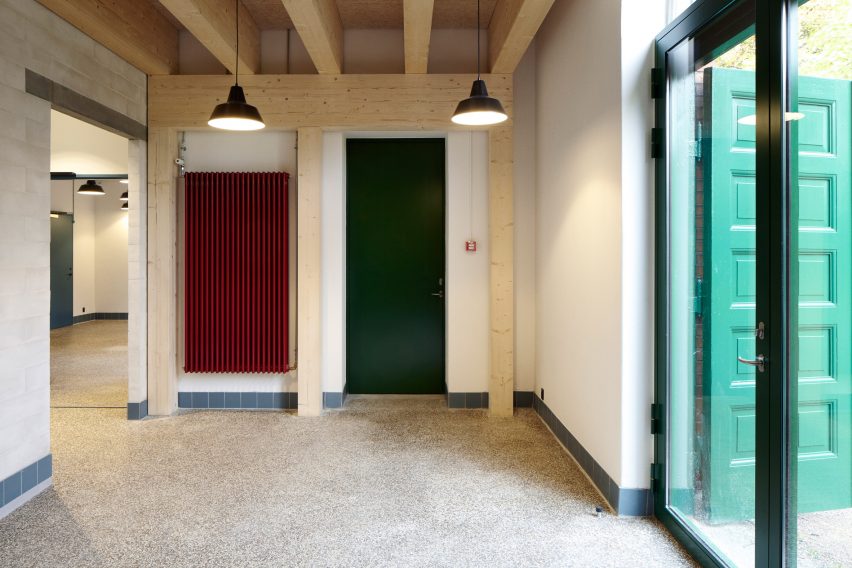 Leth & Gori converts Copenhagen chapel into cancer-care facility featuring colourful painted joinery