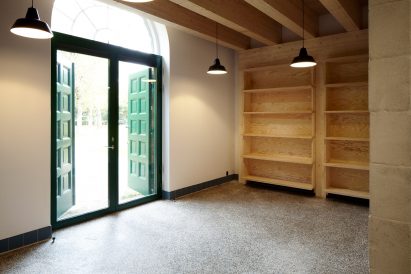 Leth & Gori converts Copenhagen chapel into cancer-care facility featuring colourful painted joinery