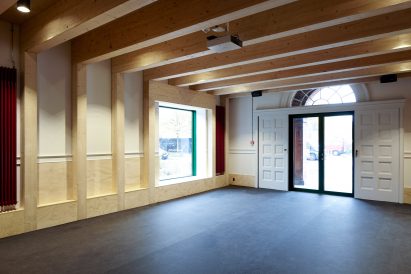 Leth & Gori converts Copenhagen chapel into cancer-care facility featuring colourful painted joinery