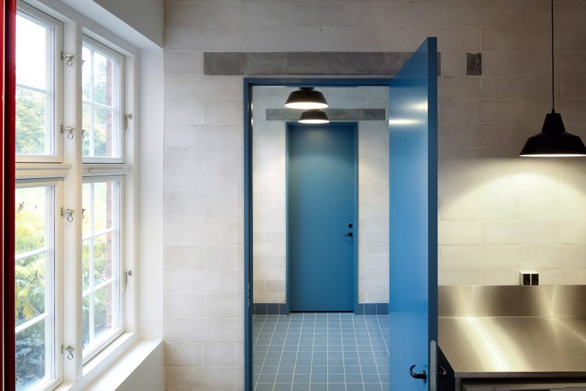 Leth & Gori converts Copenhagen chapel into cancer-care facility featuring colourful painted joinery